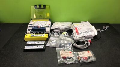 Job Lot Including 1 x Cardiac Science Powerheart AED G3 Automated External Defibrillator with 2 x Cardiac Science Powerheart AED G3 Batteries (Powers Up) 2 x Euro Energy Batteries, 4 x Zoll Onestep Electrode Pads *2 In Date, 2 Out of Date* 2 x Skintact El