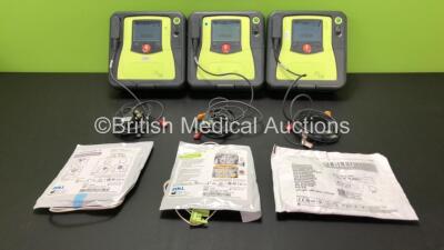 3 x Zoll AED Pro Defibrillators with 3 x Batteries, 3 x ECG Leads and 3 x Electrode Packs (All Power Up) *AA10C016604, AA07E005973 and AA10A016239*