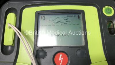 3 x Zoll AED Pro Defibrillators with 3 x Batteries, 3 x ECG Leads and 3 x Electrode Packs in Carry Cases (All Power Up, 1 x Slight Damage to Screen - See Photos) *AA07E005955, AA10C016679 and AA07D005578* - 3