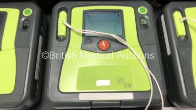 3 x Zoll AED Pro Defibrillators with 3 x Batteries, 3 x ECG Leads and 3 x Electrode Packs in Carry Cases (All Power Up, 1 x Slight Damage to Screen - See Photos) *AA07E005955, AA10C016679 and AA07D005578* - 4