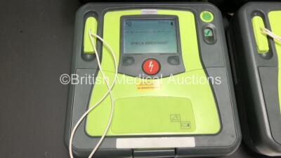 3 x Zoll AED Pro Defibrillators with 3 x Batteries, 3 x ECG Leads and 3 x Electrode Packs in Carry Cases (All Power Up, 1 x Slight Damage to Screen - See Photos) *AA07E005955, AA10C016679 and AA07D005578* - 5