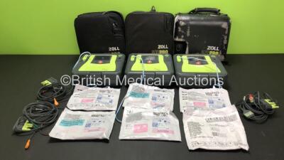 3 x Zoll AED Pro Defibrillators with 3 x Batteries, 3 x ECG Leads and 6 x Electrode Packs in Carry Cases (All Power Up, 2 x Slight Damage to Screens - See Photos)