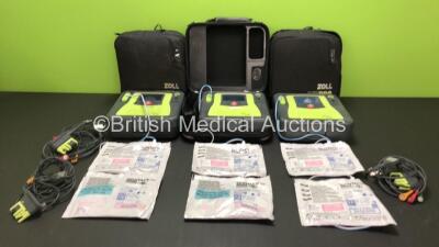 3 x Zoll AED Pro Defibrillators with 3 x Batteries, 3 x ECG Leads and 6 x Electrode Packs in Carry Cases (All Power Up, 3 x Slight Damage to Screens and 2 x Slight Damage to Casing - See Photos)