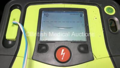 3 x Zoll AED Pro Defibrillators with 3 x Batteries, 3 x ECG Leads and 6 x Electrode Packs in Carry Cases (All Power Up, 3 x Slight Damage to Screens and 2 x Damage to Casing - See Photos) - 5