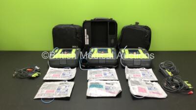 3 x Zoll AED Pro Defibrillators with 3 x Batteries, 3 x ECG Leads and 6 x Electrode Packs in Carry Cases (All Power Up, 2 x Slight Damage to Screens and 1 x Damage to Casing - See Photos)