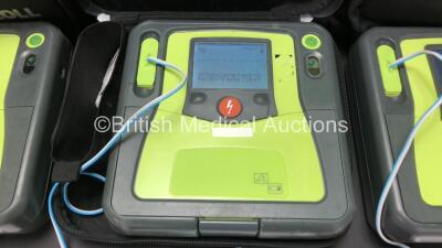 3 x Zoll AED Pro Defibrillators with 3 x Batteries, 3 x ECG Leads and 6 x Electrode Packs in Carry Cases (All Power Up, 2 x Slight Damage to Screens and 1 x Damage to Casing - See Photos) - 3