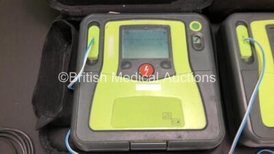 3 x Zoll AED Pro Defibrillators with 2 x Batteries, 3 x ECG Leads and 6 x Electrode Packs in Carry Cases (All Power Up, 2 x Slight Damage to Screens and 2 x Damage to Casing - See Photos) - 2