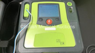 3 x Zoll AED Pro Defibrillators with 2 x Batteries, 3 x ECG Leads and 6 x Electrode Packs in Carry Cases (All Power Up, 2 x Slight Damage to Screens and 2 x Damage to Casing - See Photos) - 3