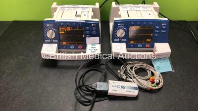 1 x Agilent Heartstream XL Defibrillator With Pacer and 1 x Philips Heartstart XL Defibrillator with 1 x ECG Lead and 1 x Paddle Lead (Both Power Up)