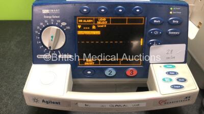 1 x Agilent Heartstream XL Defibrillator With Pacer and 1 x Philips Heartstart XL Defibrillator with 1 x ECG Lead and 1 x Paddle Lead (Both Power Up) - 2