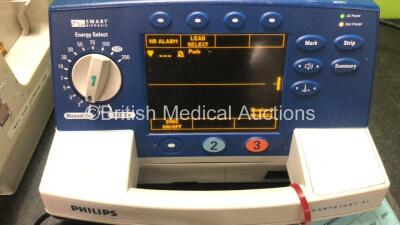 1 x Agilent Heartstream XL Defibrillator With Pacer and 1 x Philips Heartstart XL Defibrillator with 1 x ECG Lead and 1 x Paddle Lead (Both Power Up) - 3