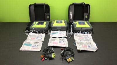 3 x Zoll AED Pro Defibrillators with 3 x Batteries, 2 x ECG Leads, 6 x Electrode Packs and 2 x Carry Cases (All Power Up, 3 x Damage to Screens and 2 x Slight Damage to Casing - See Photos)