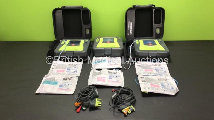 3 x Zoll AED Pro Defibrillators with 3 x Batteries, 2 x ECG Leads, 6 x Electrode Packs and 2 x Carry Cases (All Power Up, 3 x Damage to Screens and 2 x Slight Damage to Casing - See Photos)