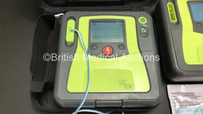 3 x Zoll AED Pro Defibrillators with 3 x Batteries, 2 x ECG Leads, 6 x Electrode Packs and 2 x Carry Cases (All Power Up, 3 x Damage to Screens and 2 x Slight Damage to Casing - See Photos) - 2