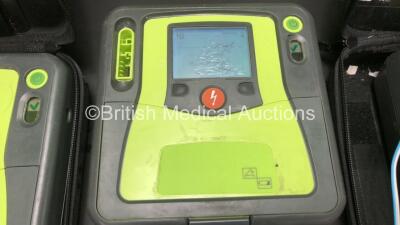 3 x Zoll AED Pro Defibrillators with 3 x Batteries, 2 x ECG Leads, 6 x Electrode Packs and 2 x Carry Cases (All Power Up, 3 x Damage to Screens and 2 x Slight Damage to Casing - See Photos) - 3