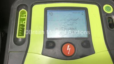 3 x Zoll AED Pro Defibrillators with 3 x Batteries, 2 x ECG Leads, 6 x Electrode Packs and 2 x Carry Cases (All Power Up, 3 x Damage to Screens and 2 x Slight Damage to Casing - See Photos) - 4