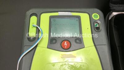 3 x Zoll AED Pro Defibrillators with 2 x Batteries, 3 x ECG Leads, 9 x Electrode Packs and 1 x Carry Case (All Power Up, 2 x Damage to Screens and 1 x Slight Damage to Casing - See Photos) - 2