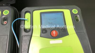 3 x Zoll AED Pro Defibrillators with 2 x Batteries, 3 x ECG Leads, 9 x Electrode Packs and 1 x Carry Case (All Power Up, 2 x Damage to Screens and 1 x Slight Damage to Casing - See Photos) - 3