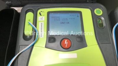 3 x Zoll AED Pro Defibrillators with 2 x Batteries, 3 x ECG Leads, 9 x Electrode Packs and 1 x Carry Case (All Power Up, 2 x Damage to Screens and 1 x Slight Damage to Casing - See Photos) - 5