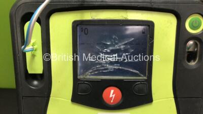 3 x Zoll AED Pro Defibrillators with 2 x Batteries and 3 x Electrode Packs (All Power Up, 3 x Damage to Screens - See Photos) - 3