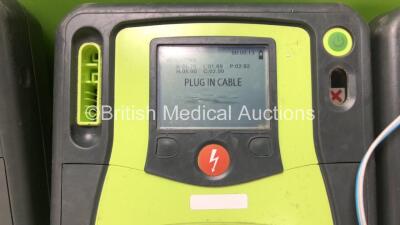 3 x Zoll AED Pro Defibrillators with 2 x Batteries and 3 x Electrode Packs (All Power Up, 3 x Damage to Screens - See Photos) - 5