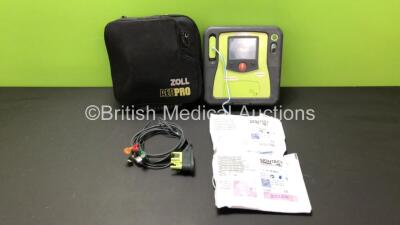 Zoll AED Pro Defibrillator with Battery and 2 x Electrode Packs (Powers Up, Damage to Screen - See Photos)