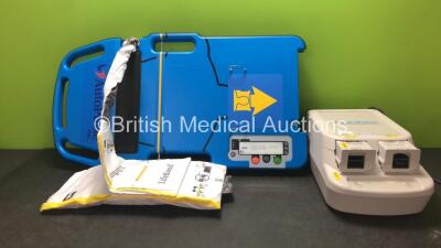 Job Lot Including 1 x Zoll Autopulse Resuscitation System Model 100 with 1 x Life Band Strap, 1 x Zoll Auto Pulse Multi Chemistry Battery Charger with 3 x Zoll Auto Pulse Li-Ion Batteries (Powers Up) *SN 140718154, 56559, 57082, 23742, 60351*