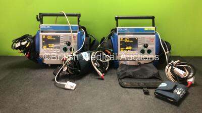 2 x Zoll M Series Biphasic 200 Joules Max Defibrillators Including Pacer, ECG, SpO2 and Printer Options with 2 x Batteries, 2 x 3 Lead ECG Leads, 2 x Paddle Leads, 2 x NIBP Hoses, 2 x BP Cuffs and 2 x SpO2 Finger Sensors in Carry Bags (Both Power Up)