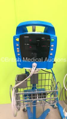 2 x GE ProCare Auscultatory Vital Signs Monitors on Stands with BP Hoses, 1 x GE Carescape V100 Vital Signs Monitor on Stand with SPO2 Finger Sensor and BP Hose and 1 x GE Dinamap Pro 400 Vital Signs Monitor on Stand with SPO2 Finger Sensor and BP Hose (A - 3