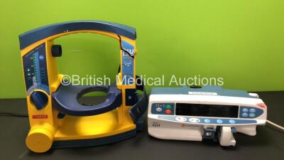 Mixed Lot Including 1 x LSU Suction Unit (Powers Up with Damaged Casing and Missing Dial - See Photos) and 1 x Alaris GH Carefusion Syringe Pump (Powers Up with Blank Screen and Alarm)
