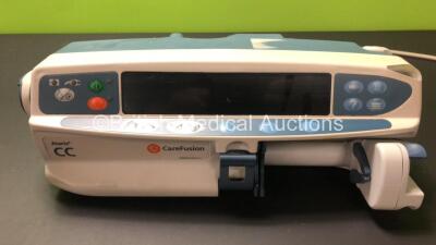 Job Lot Including 1 x Cardinal Health Alaris CC Syringe Pump, 3 x CareFusion Alaris CC Syringe Pumps and 1 x Asena Alaris CC Syringe Pump (2 x Require Service, 1 x Powers Up with Blank Screen, 2 x No Power, 2 x Missing Casing - See Photos) - 8