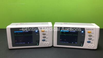 2 x Philips Intellivue X2 Handheld Patient Monitors S/W Rev H.15.51 and K.21.39 Including ECG, SpO2, NBP, Press and Temp Options *Both Mfd 2015* (Both Power Up with Stock Batteries) and 2 x Philips M4607A Batteries (Flat Batteries) *W*