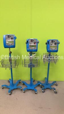 2 x GE Dinamap Pro 400V2 Vital Signs Monitors on Stands and 1 x GE Dinamap Pro 300V2 Vital Signs Monitor on Stand (All Power Up)