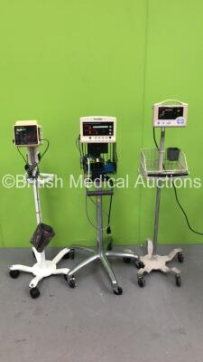 Job Lot Including 1 x Welch Allyn 52000 Series, 1 x Criticare SpO2 / Comfort Cuff Monitors on Stands (Both Power Up) and 1 x MasimoSET SpO2 CAS740 Monitor on Stand (Powers Up with Error)