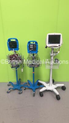 2 x GE ProCare Vital Signs Monitors on Stands (1 x Missing Front Display Panel) and 1 x GE Dash 4000 Patient Monitor on Stand with SPO2, Temp/Co, NBP and ECG Options (All Power Up)