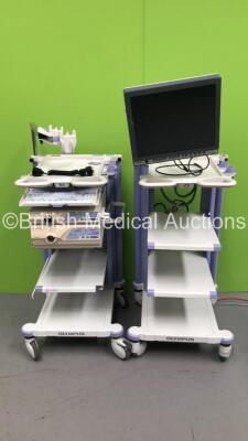 2 x Olympus Stack Trolleys with Olympus OEV191H Monitor, Olympus Evis Lucera CV-260 Digital Processor, Olympus Evis Lucera CLV-260 Light Source and Olympus MAJ-1154 PIgtail Connector (Powers Up)