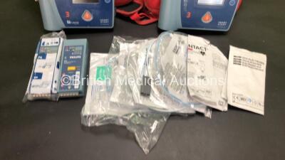 Job Lot Including 1 x Laerdal HeartStart FR2+ Defibrillator and 1 x Philips HeartStart FR2+ Defibrillator with 4 x Batteries (Install Dates - 02/2019, 06/2026, 06/2026 and 02/2022) 4 x Skintact DF27NC Electrodes (Expiry Dates - 2 x 2023 and 2 x 2022) and - 4