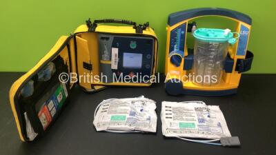 Mixed Lot Including 1 x Laerdal Heartstart FR2 Defibrillator in Carry Case (Powers Up with Stock Battery, 1 x Flat Battery Included) with 2 x Electrode Packs *Both Expire 2024* and 1 x LSU Suction Unit with Cup (Powers Up, Missing Battery and Damaged Casi