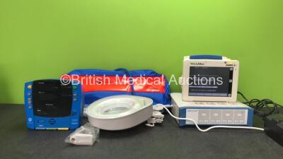 Mixed Lot Including 1 x Datex Ohmeda Analgesic Equipment Entonox Carry Case, 1 x Dinamap V100 Patient Monitor (No Power when Tested with Stock Power Supply) 1 x Circular Illuminated Magnifier (Powers Up) 1 x Aesculap Battery Charger (Powers Up) 1 x Welch 
