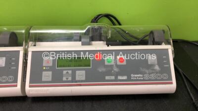 2 x Graseby 3300 Syringe Pumps and 1 x Graseby PCA Pump (All Power Up with Damaged Syringe Guards-See Photos) *SN 018785, N/A, N/A* - 3