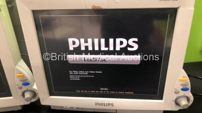 2 x Philips IntelliVue MP70 Patient Monitors and 1 x Philips IntelliVue MP70 Anesthesia Patient Monitor (All Power Up - 2 x Damaged Casing, See Photos) - 2