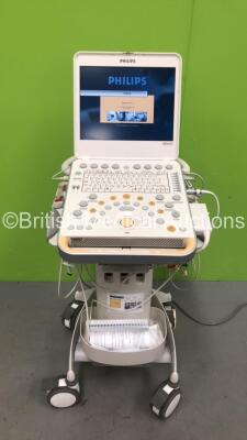 Philips CX50 Portable Ultrasound Scanner Ref 989605384711 *S/N SGD1209308* **Mfd 2012** Revision 3.0.1 with 2 x Transducers / Probes (S5-1 and D2cwc) on Philips CX Cart (Powers Up - Missing Rubber from Wheels)