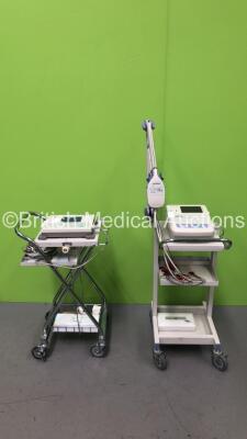 1 x Nihon Kohden ECG-1350K Cardiofax M Electrocardiograph Machine on Stand with 1 x 10 Lead ECG Lead and 1 x Nihon Kohden ECG-9020K Cardiofax GEM Electrocardiograph Machine on Stand with 1 x 10 Lead ECG Lead (Both Power Up)