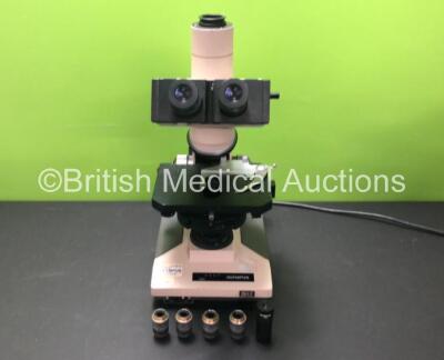 Olympus BH-2 Benchtop Microscope (Powers Up) with 2 x Olympus WHK 10x/20 Eyepieces, 4 x Optics Including 1 x DPlan 10 0.25 160/0.17, 1 x A 10 PL 0.25 160/0.17, 1 x LWD C A 20 PL 0.40 160/1.2, 1 x DPlan 4 0.10 160/0.17 and 1 x Olympus NFK 2.5 x LD Eyepiece