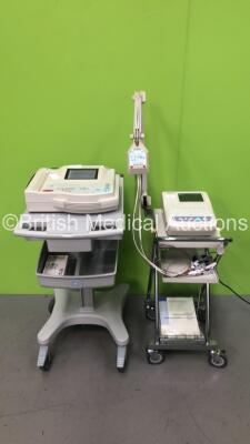 1 x Nihon Kohden ECG-1350K Cardiofax M Electrocardiograph Machine on Stand with 1 x 10 Lead ECG Lead and 1 x GE Mac 1200 ST ECG Machine on Stand (Both Power Up)