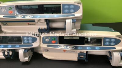 Job Lot Including 4 x CareFusion Alaris GH Syringe Pumps and 1 x Cardinal Health Alaris GH Syringe Pump (All Power Up, 1 x Does Not Charge, 2 x Damage to Casing - See Photos) - 4