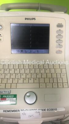 1 x Luxo Patient Examination Lamp on Stand (Powers Up), 2 x Standing Aids and 1 x Philips PageWriter Trim II ECG Machine on Stand with 10 Lead ECG Leads (Powers Up) *S/N FS0124123* - 2