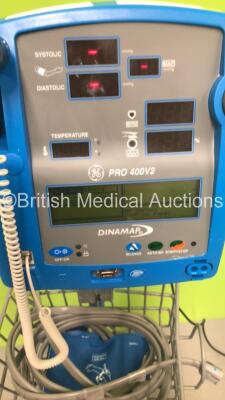 4 x GE Dinamap Pro 400V2 Vital Signs Monitors on Stands with a Selection of Leads (All Power Up) *S/N AAX06380067SA / AAX06380060SA / AAX08230152SA / AAX08100024SA* - 4