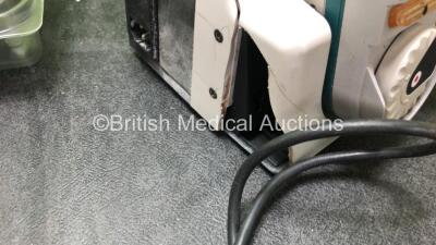 Mixed Lot Including 1 x Ambu Uni Suction Footswitch, 1 x Richard Wolf Foot Pedal, 1 x AND TM 2020 Processor with Bp Cuff (Untested Due to Possible Flat Batteries) 1 x 001829E Battery *Untested* 1 x Boston Scientific Latitude Communicator Unit, 1 x Ohmeda - 6