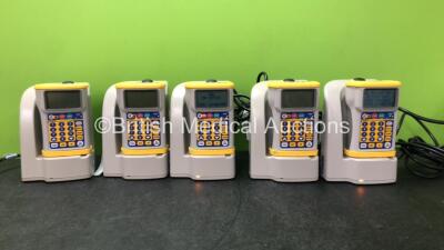 5 x Hospira Gemstar Pumps with 5 x Base Charging Stations (2 Power Up, 1 with Service Message, 3 No Power)